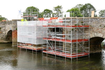 bidford-bridge-scaffolding-1 Scaffolding on a commercial building on the public highway showing steel hoarding