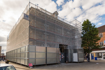 Scaffolding on Market Hall Museum in Warwick Scaffolding on a commercial building on the public highway showing steel hoarding